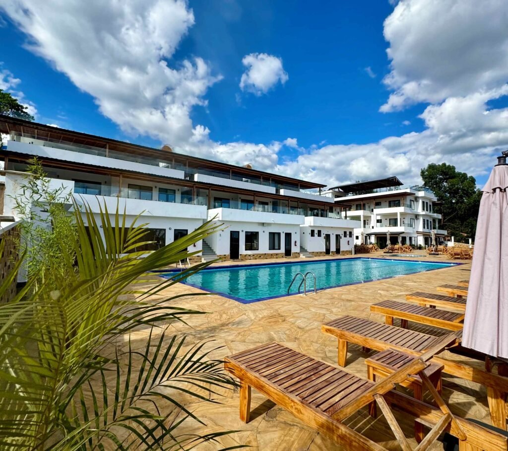 Apartment Building and The Main Building with a swimming pool view.